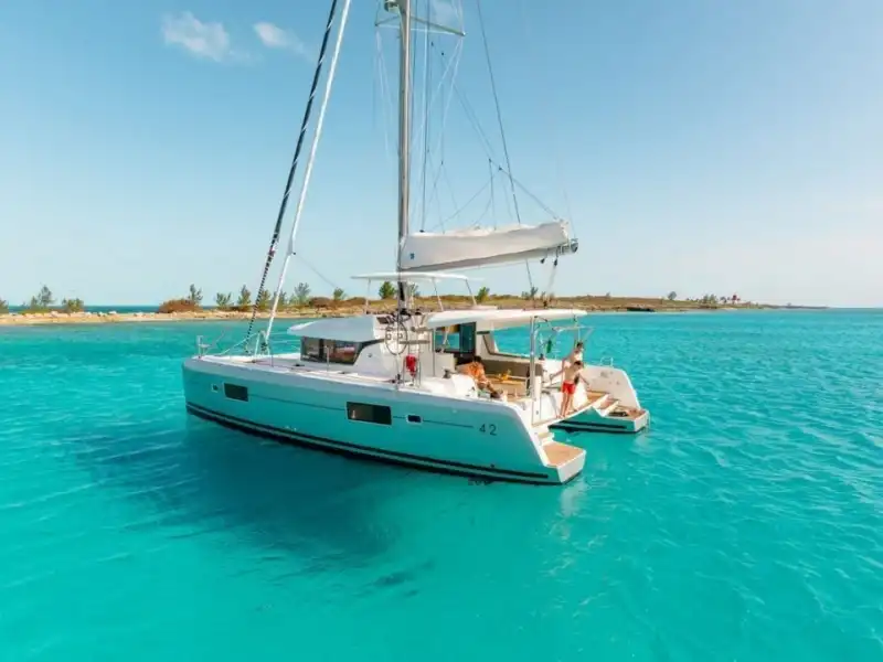 Lagoon 42 catamaran at anchor in a clear turquoise bay