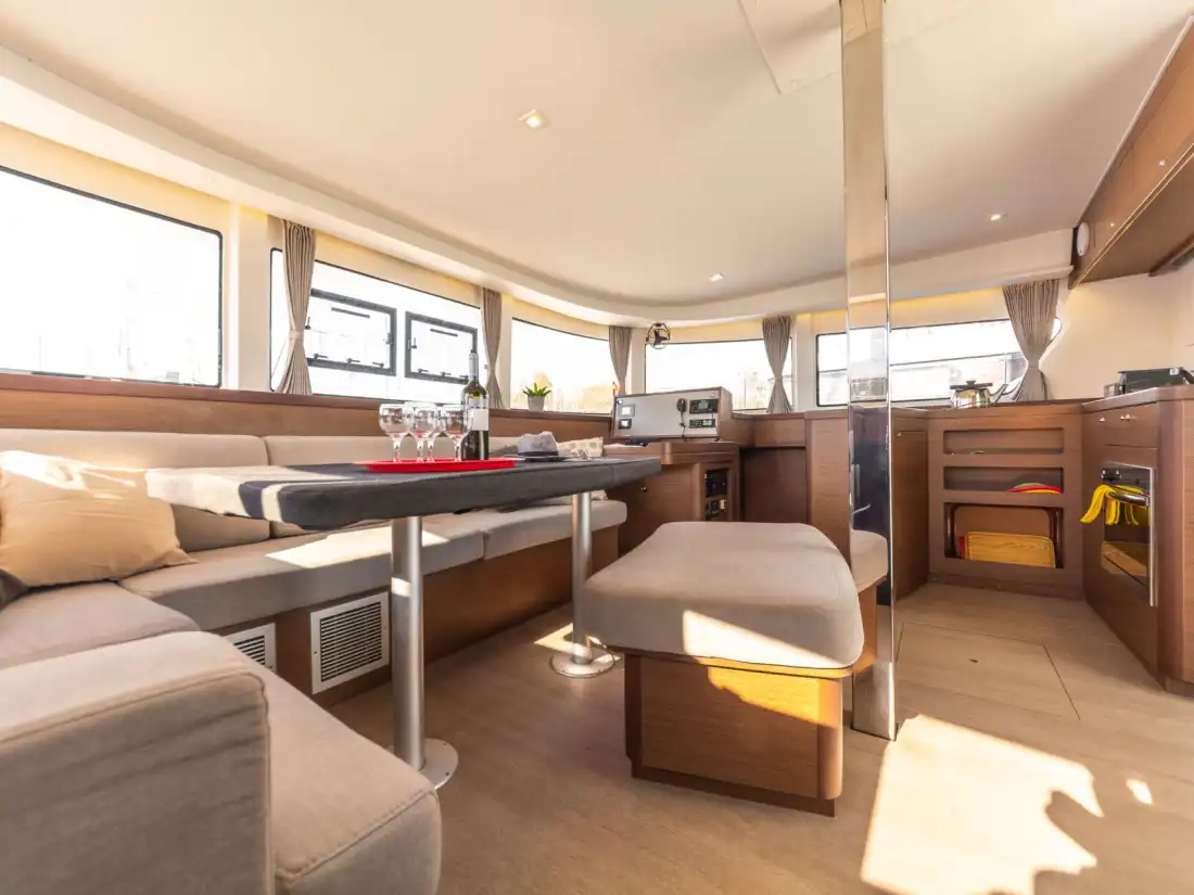 Bright saloon and galley of the Lagoon 42 with panoramic windows