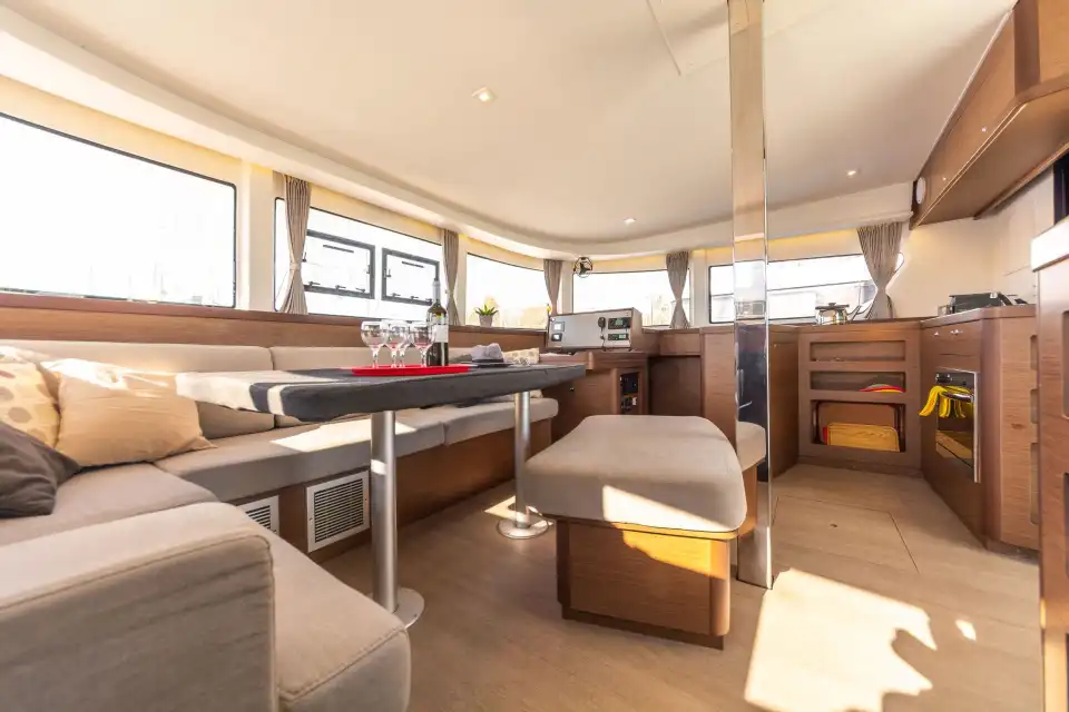 Bright saloon and galley of the Lagoon 42 with panoramic windows